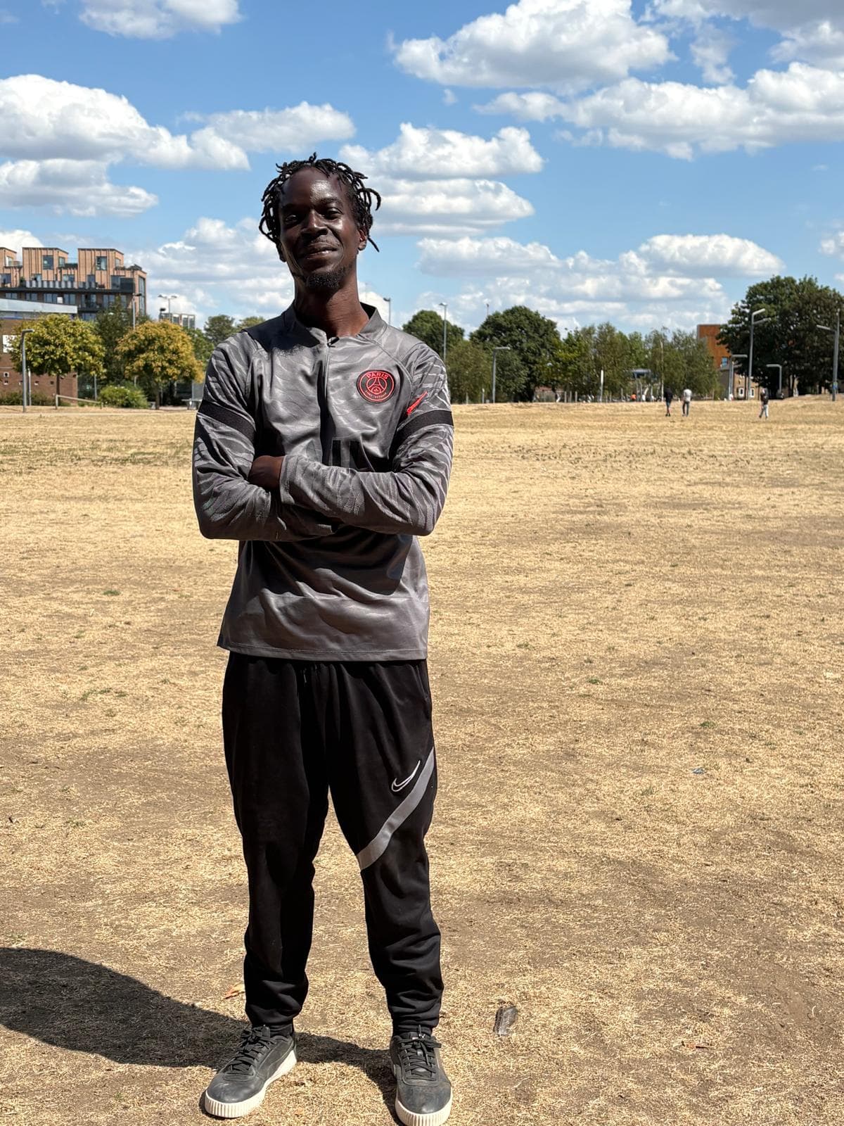 Lead coach standing on the training field