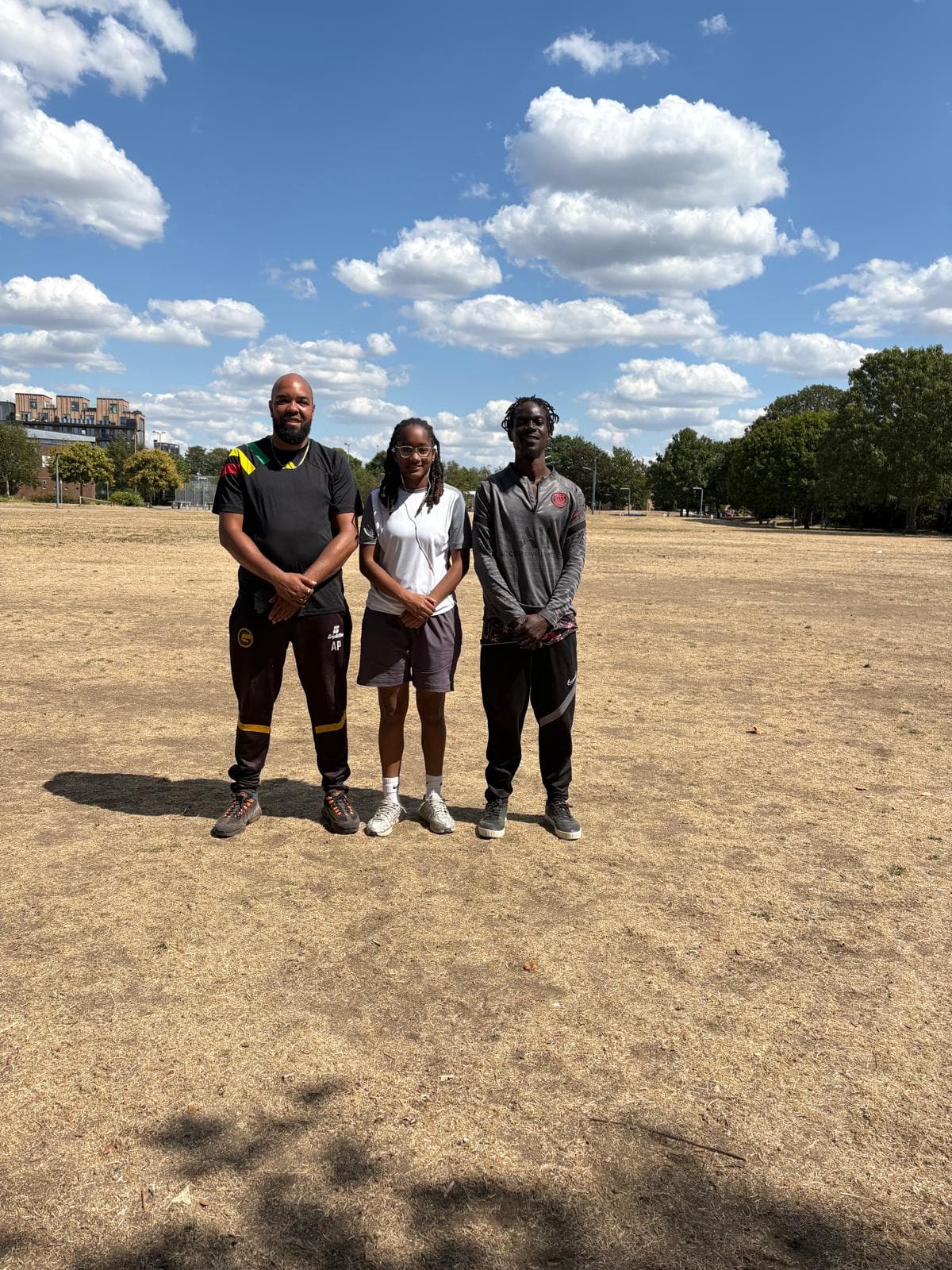 Academic Football coaches standing together outdoors
